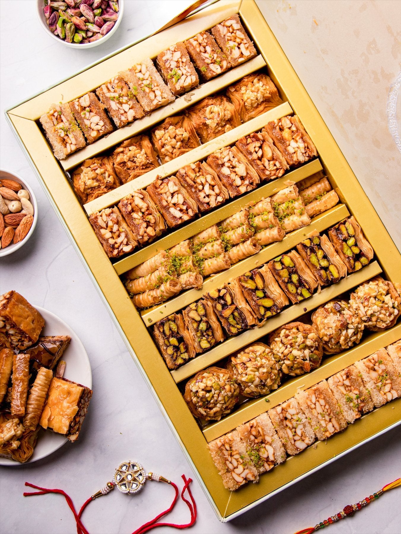 Rakhi Gift Box : Royal Vega Box (1 kg) Baklavas With 2 Rakhi- Premium Rakhi gift box - THE BAKLAVA BOX